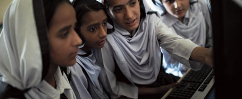 Students working on educational programs in Rawalpindi, Pakistan.