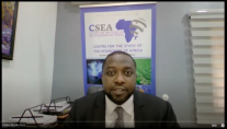 Screenshot of video: Speaker in front of panel sign for CSEA.