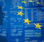 EU flag and map superimposed on photo of woman staring at data on a large screen.
