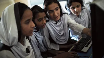 Students working on educational programs in Rawalpindi, Pakistan.