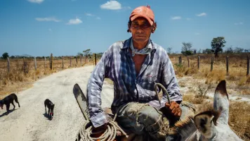 Farmer on Mule With Chainsaw, El Abra Colombia - Adam Cohn