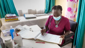 a nurse in Kenya reviews records