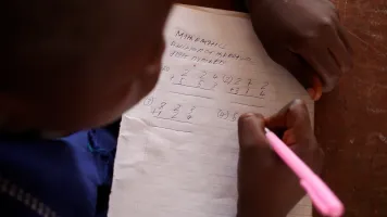 A student working in class in Sierra Leone. Credit: GPE/Stephan Bachenheimer