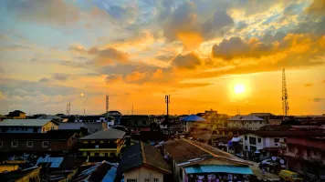 Neighborhood skyline at sunset, Lagos, Nigeria, 2019. 