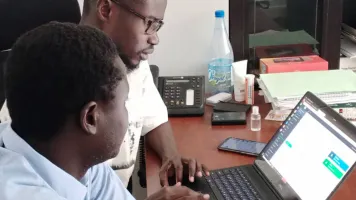 Jean Paul Ngom and Ibrahima Diop, of Senegal’s national statistical office, working with an NVIDIA GPU-powered mobile workstation