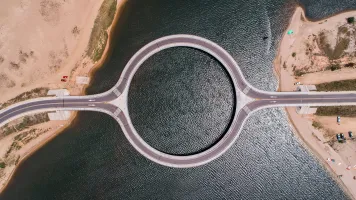 An aerial, bird's eye view of the Circle Garzon Bridge in Punta del Este, Uruguay