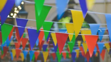 Colourful flags - Unsplash/Chris Lawton