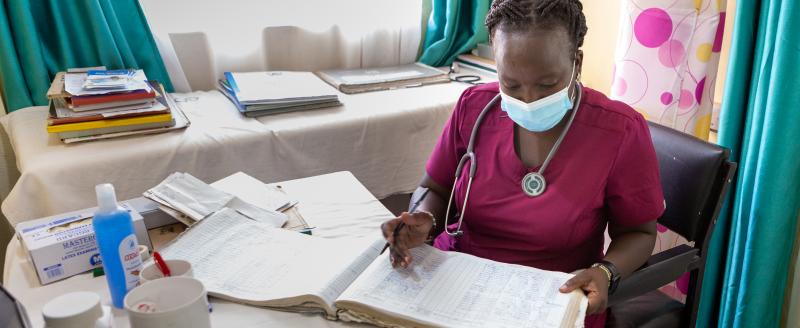 a nurse in Kenya reviews records
