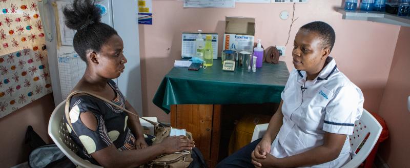 Macknophear Mose consulting with nurse Mary Mwakughu at the hospital in Kilifi County, Kenya. Credit: Elphas Ngugi/GPSDD