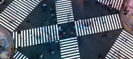 Traffic and people cross a busy intersection in Ginza, Tokyo. Credit: TierneyMJ/Shutterstock