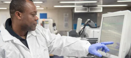 A Ghanaian, a laboratory technician assigned to hospital ship USNS Mercy, inputs and logs data samples in the ship’s laboratory in 2022. Investment is needed to improve data quality and availability. Copyright: Jake Greenberg (CC BY-NC 2.0)