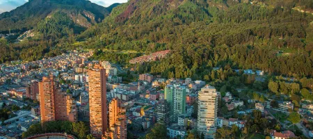 An aerial view of the center of Bogota, Colombia, with the Andes in the background. Photo by Jess Kraft, via Shutterstock