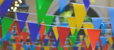 Colourful flags - Unsplash/Chris Lawton