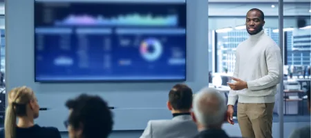 Image of a man presenting a data dashboard / Shutterstock 