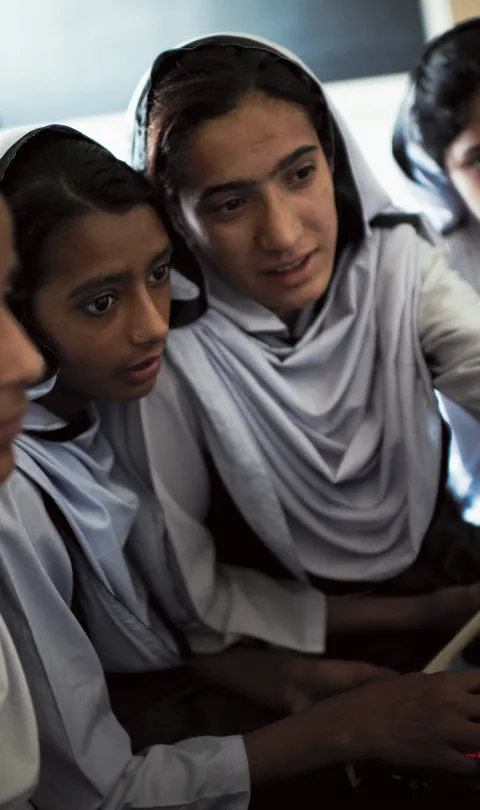 Students working on educational programs in Rawalpindi, Pakistan.