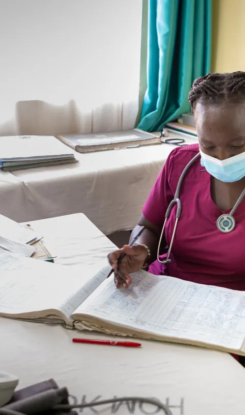 a nurse in Kenya reviews records
