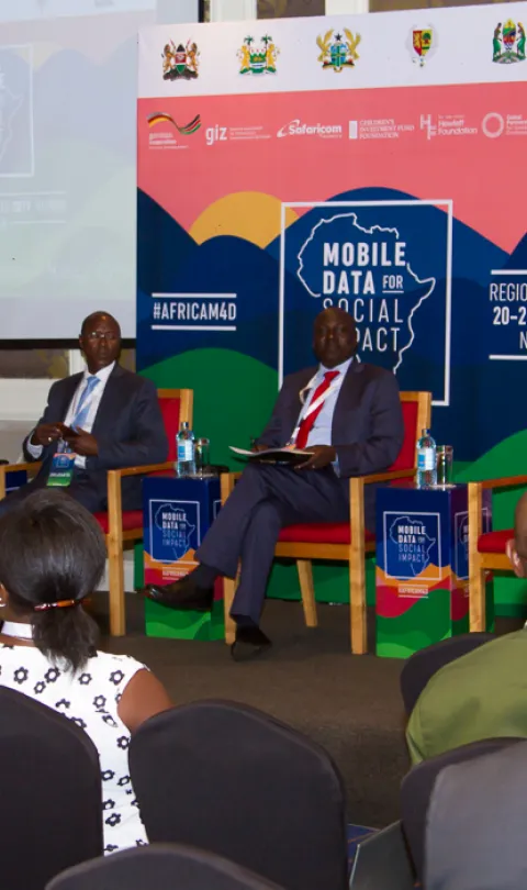 Panelists on a stage at the event