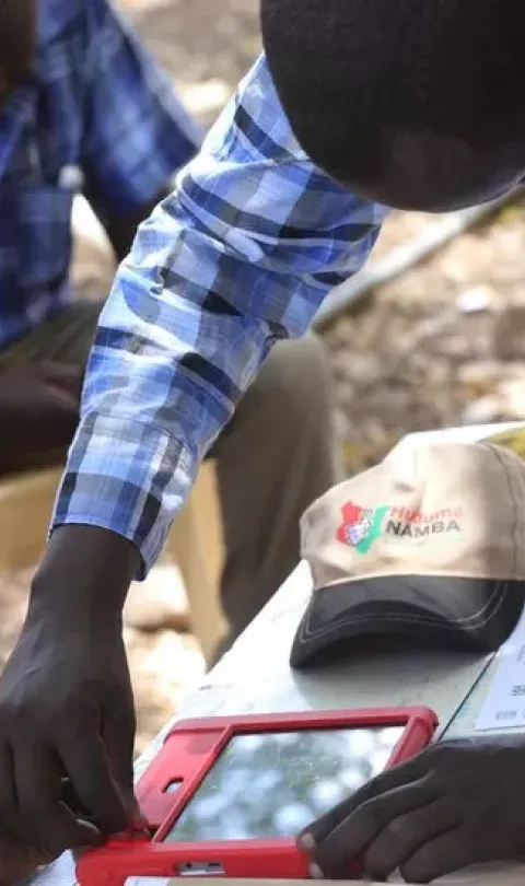 Kenyan getting their fingerprint taken as part of Huduma Namba in 2019. Credit: Getty Images.