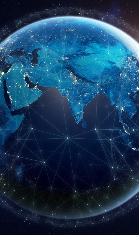 A photo of earth from space with lines illustrating data exchange across continents.