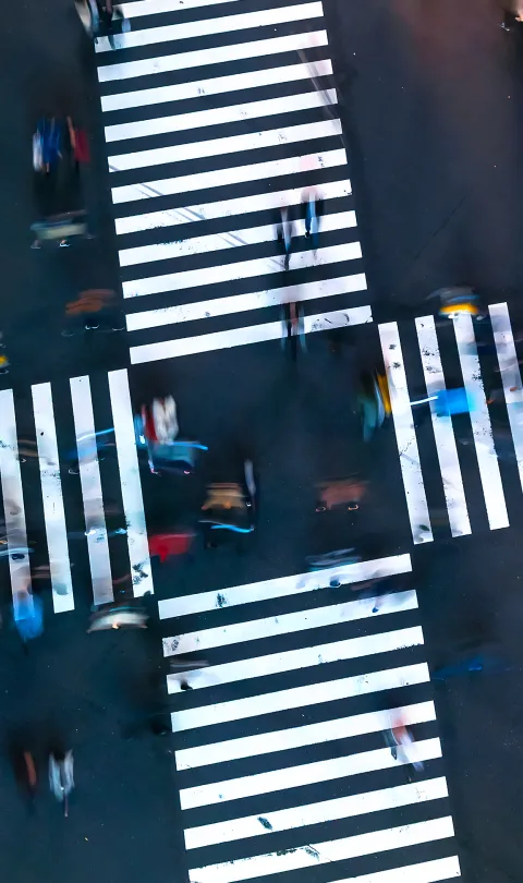 Traffic and people cross a busy intersection in Ginza, Tokyo. Credit: TierneyMJ/Shutterstock
