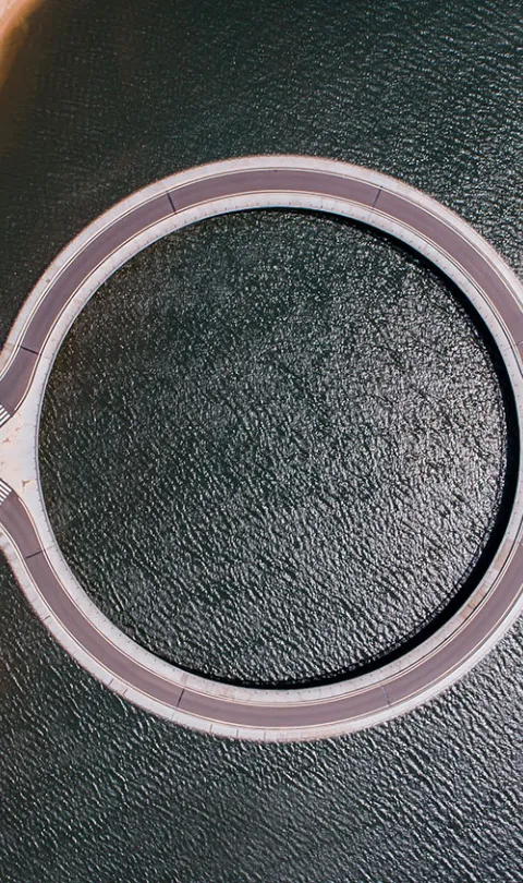 An aerial, bird's eye view of the Circle Garzon Bridge in Punta del Este, Uruguay