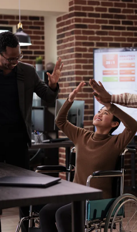 multiethnic-group-people-having-fun-work-break-laughing-enjoying-conversation-with-paralyzed-employee-woman-living-with-physical-chronic-disability-wheelchair-job