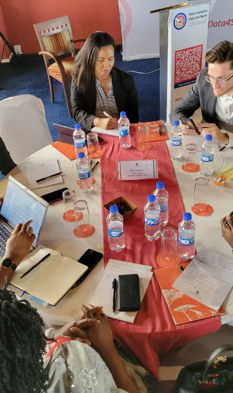 Partners from Colombia, Ghana, and Kenya in deep discussion during a MIDN peer exchange session