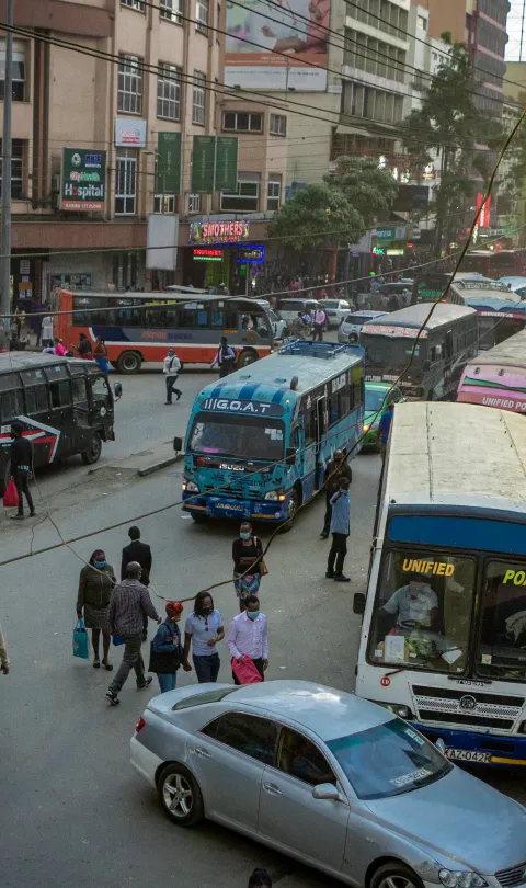 People walk on a street in Nairobi