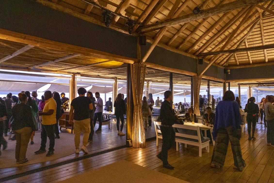 Caption: Participants at an evening networking event during Festival De Datos in Uruguay (2023)