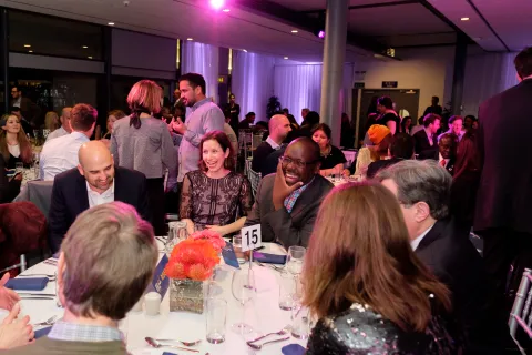 People socializing at event dinner
