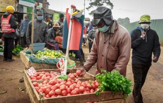 A vegetable hawker at Wangige Market in Kiambu, Kenya